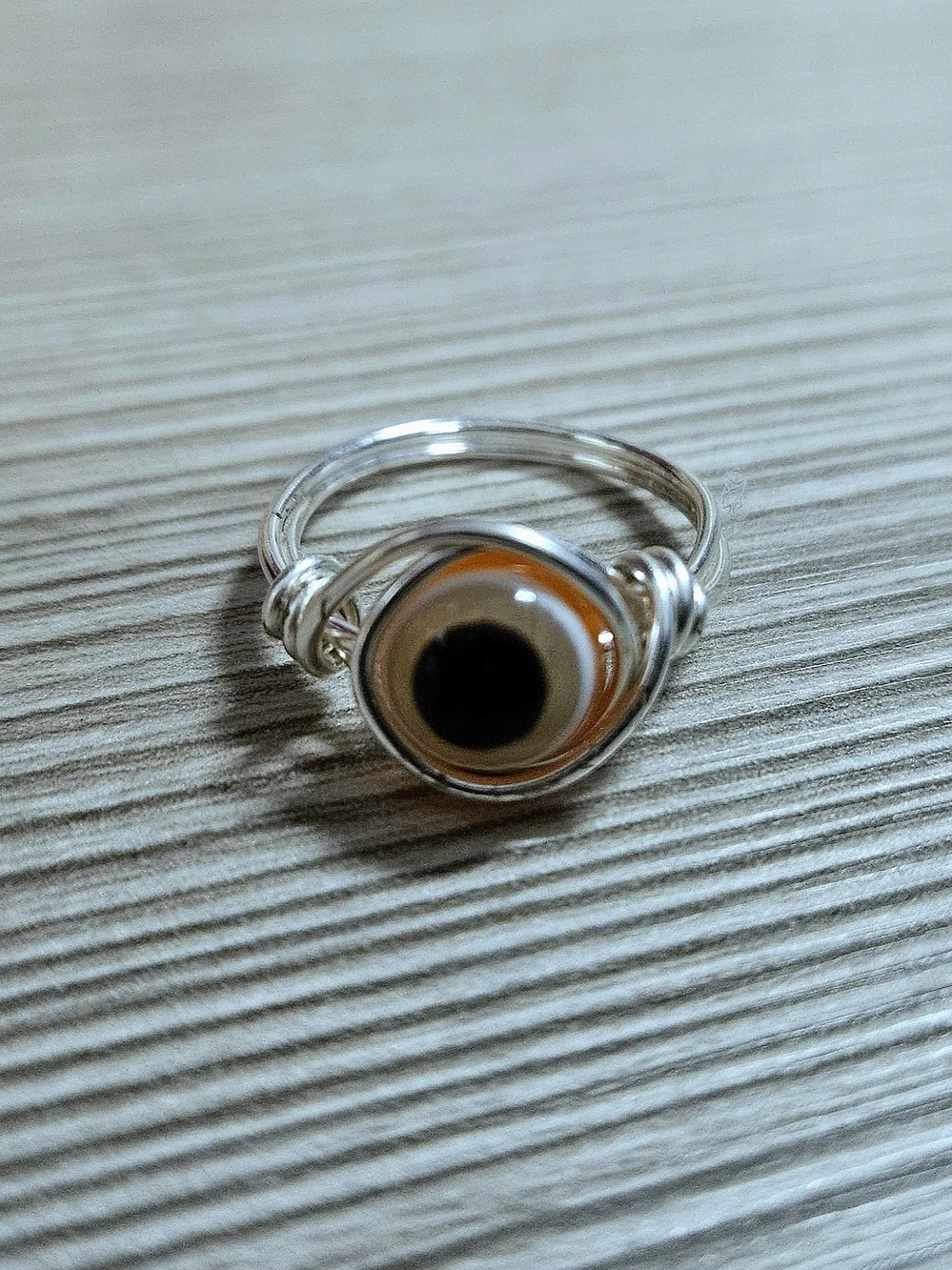 Silver Wire Evil Eye Ring with Orange and Black Glass Accent
